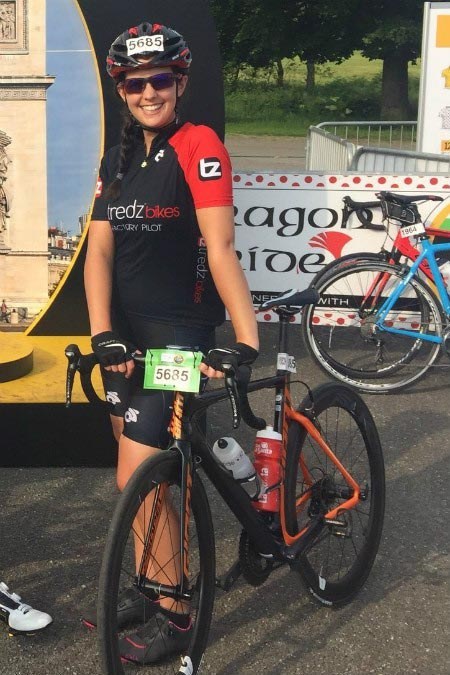 Danni happily posing with her Giant bike